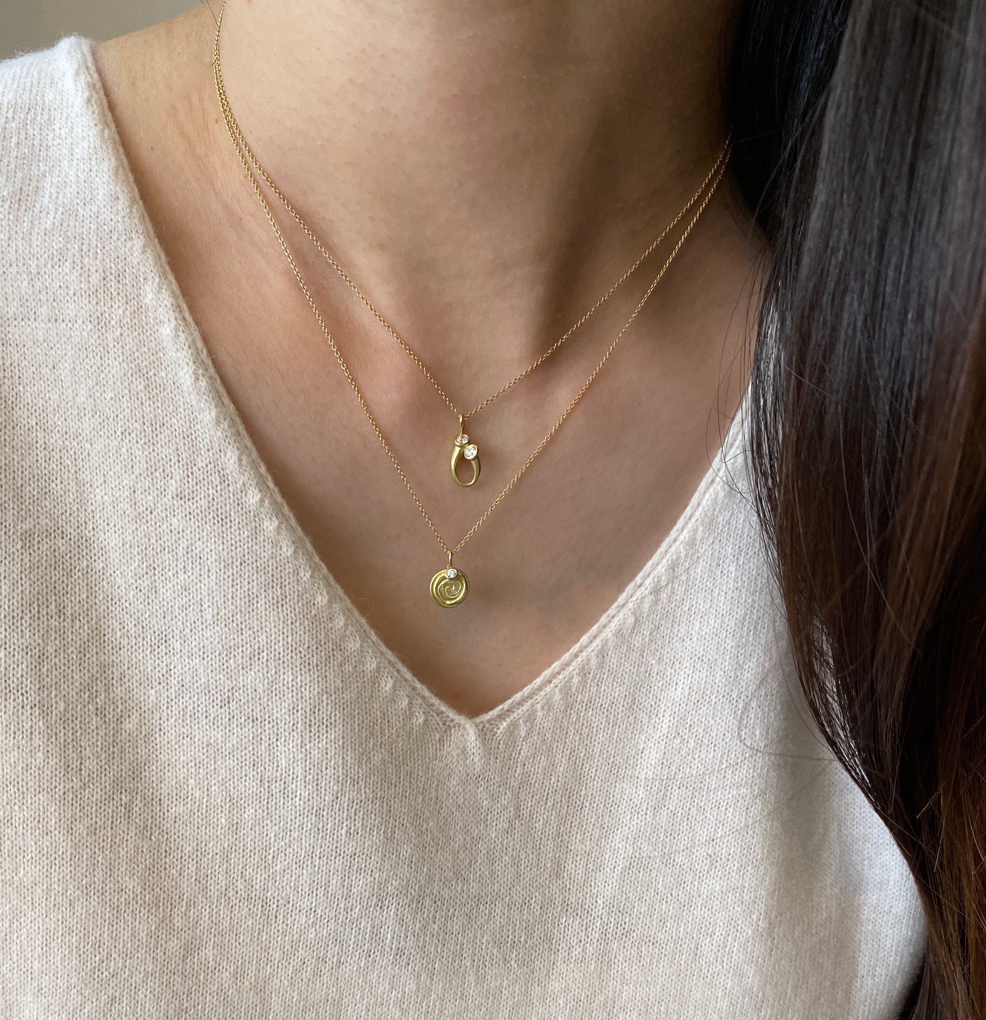 Delicate tear drop pendant in gold with round diamonds by Ayesha Mayadas