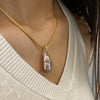 Iridescent fresh water pearl with 18K yellow bail and hand woven chain