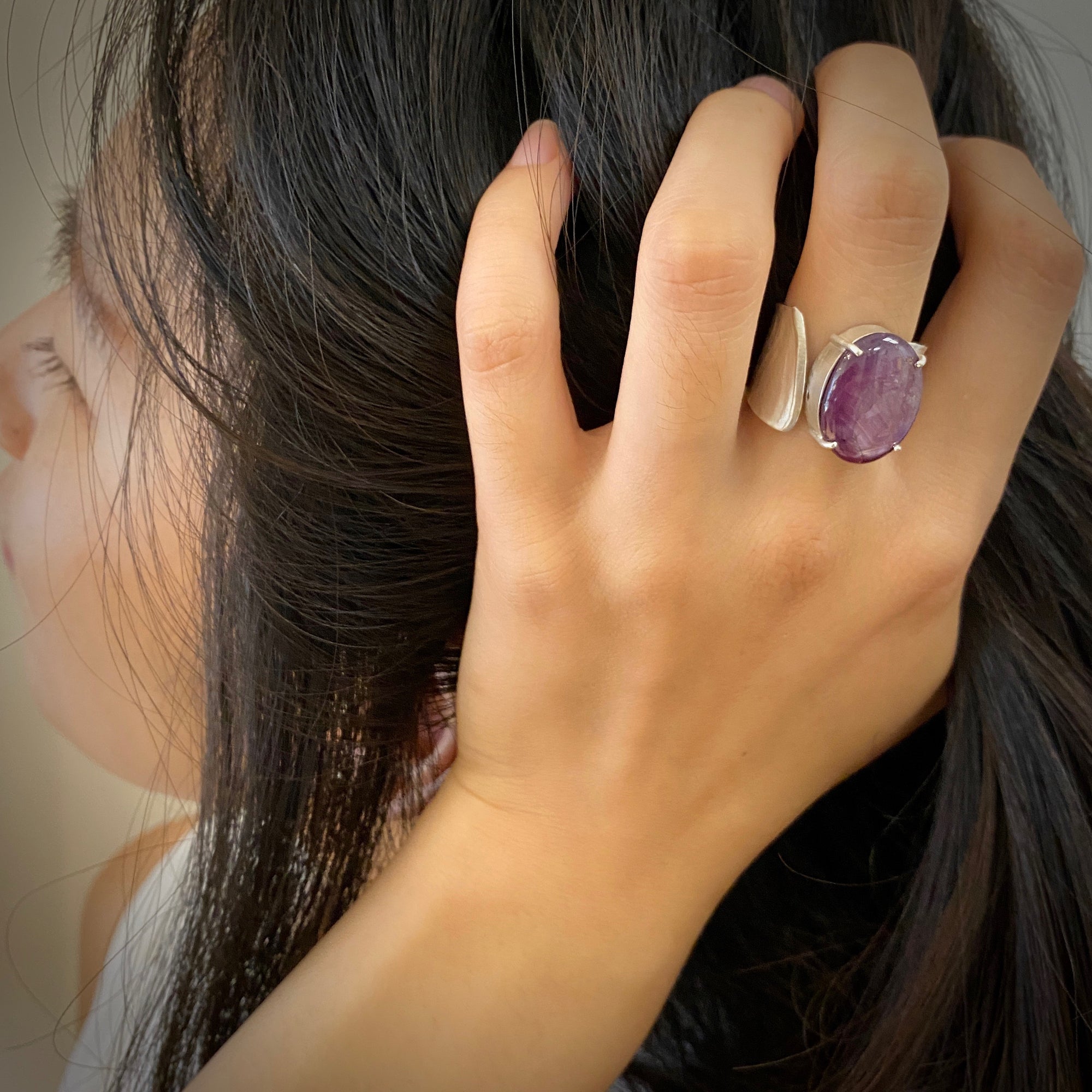 Wide Wafer texture ring in sterling silver with a large oval Star Ruby cabochon by Ayesha Mayadas shown on model