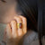 Madiera citrine 18K yellow gold wafer ring by Ayesha Mayadas shown on a model