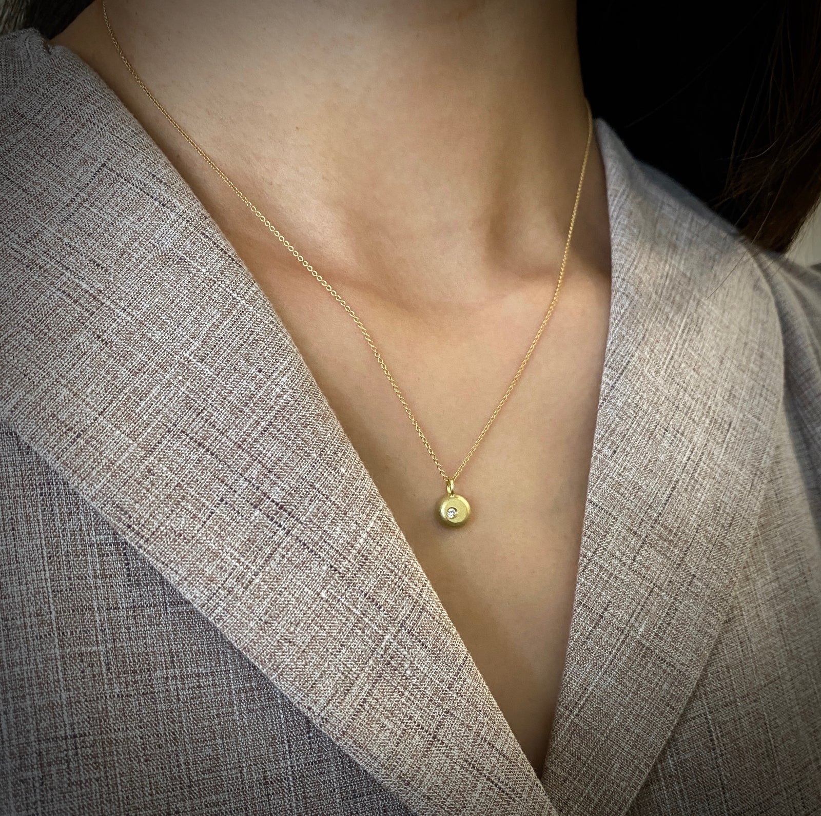 18Kt yellow gold and diamond pendant in a nugget motif made by Ayesha Mayadas