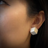Model wearing three dimensional cube earrings in sterling silver made by Michele Mercaldo