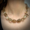 Rutilated quartz faceted beads with forged 18K pink and yellow gold and copper toggle clasp by Ayesha Mayadas