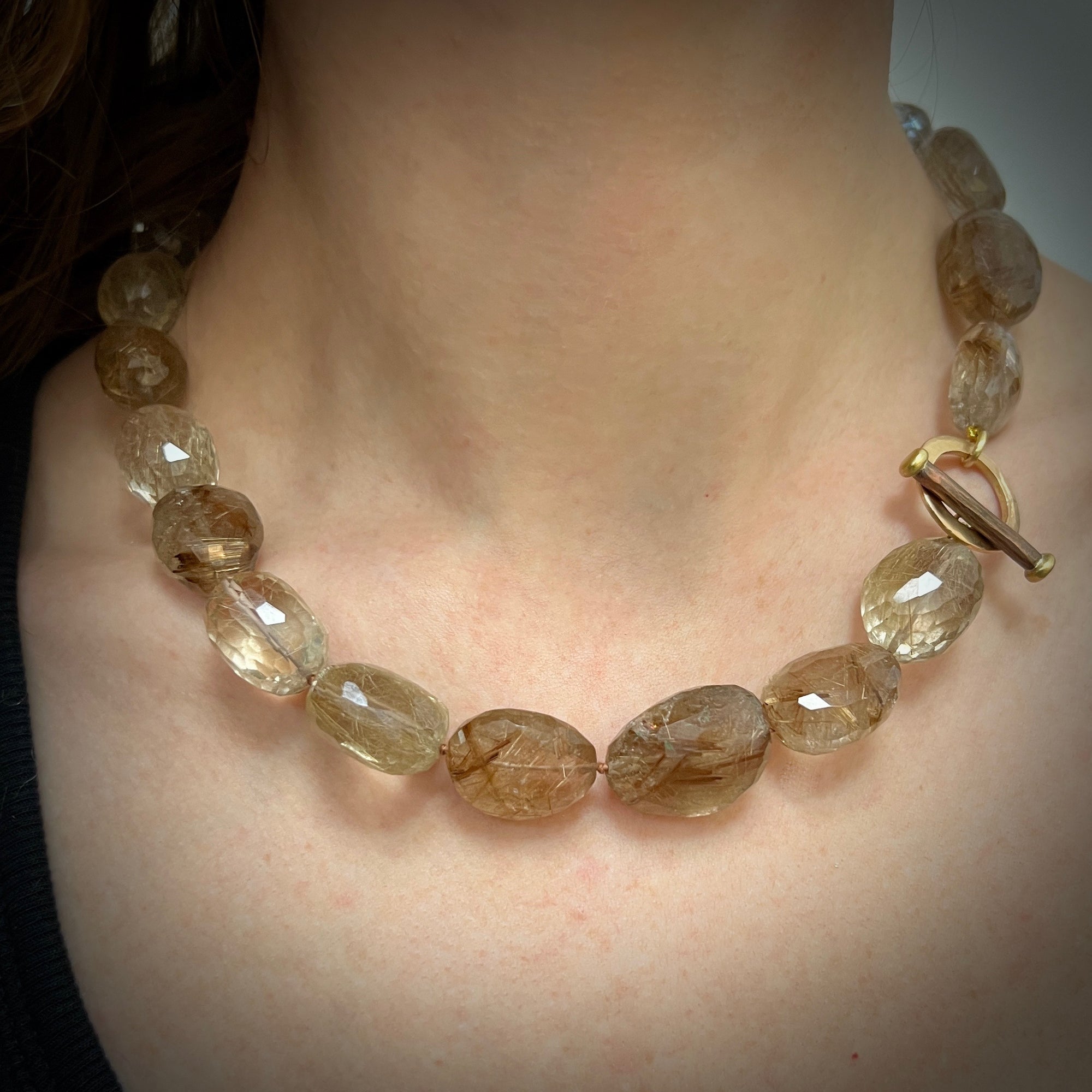 Rutilated quartz faceted beads with forged 18K pink and yellow gold and copper toggle clasp by Ayesha Mayadas