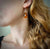 Brilliant orange amber earrings set in 18K pink gold