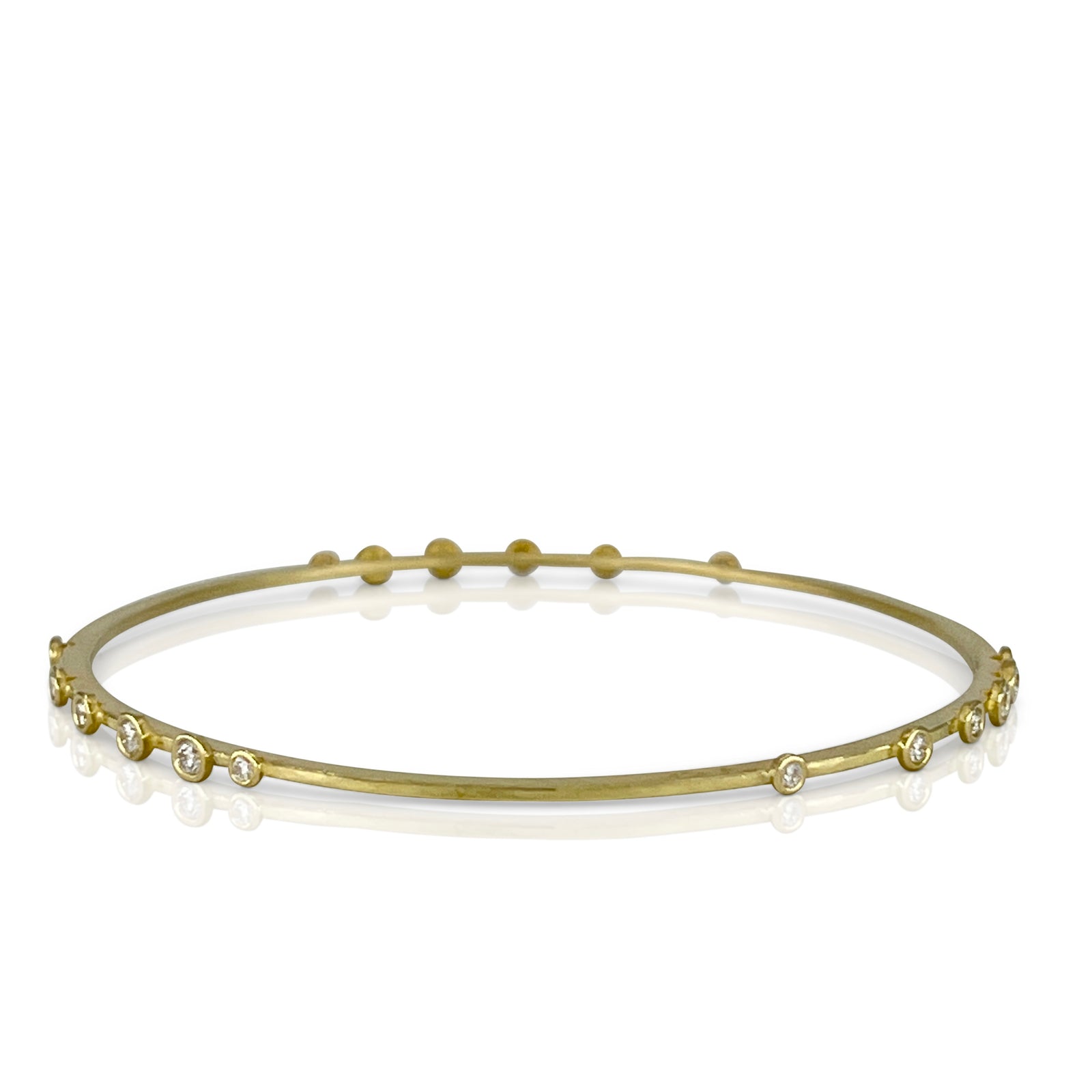 Linear diamond bangle bracelet in 18K yellow Gold with 18 diamonds in 3 linear groupings made by Ayesha Mayadas