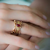Serpentine ring in 18K gold with 8 diamonds shown on model by Ayesha Mayadas