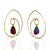 Spiral hoops in gold with dangling opals