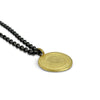 Spiral, coin-like pendant in 18K yellow gold