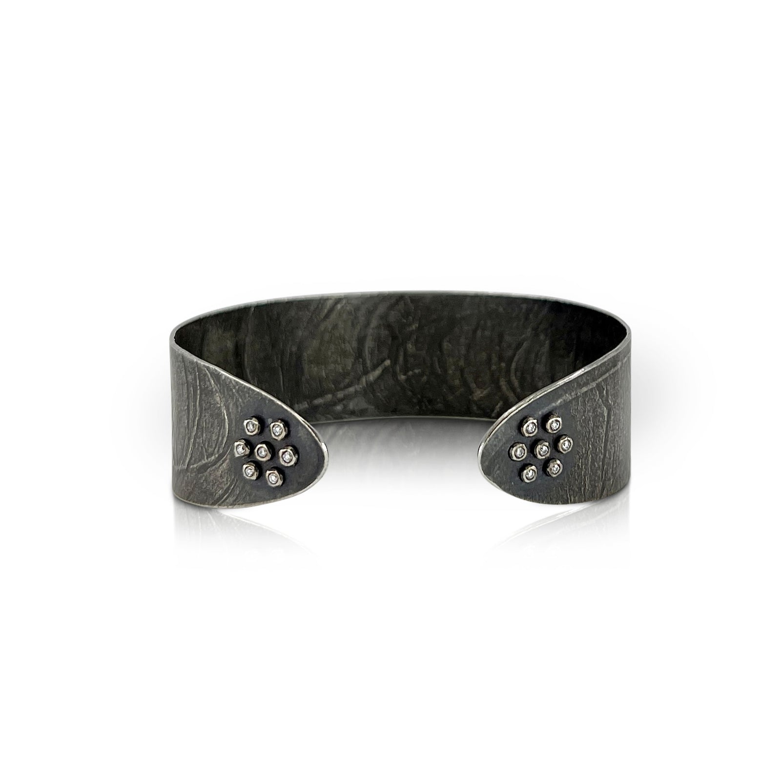 Narrow wafer cuff in oxidized sterling silver with 14 diamonds by Ayesha Mayadas