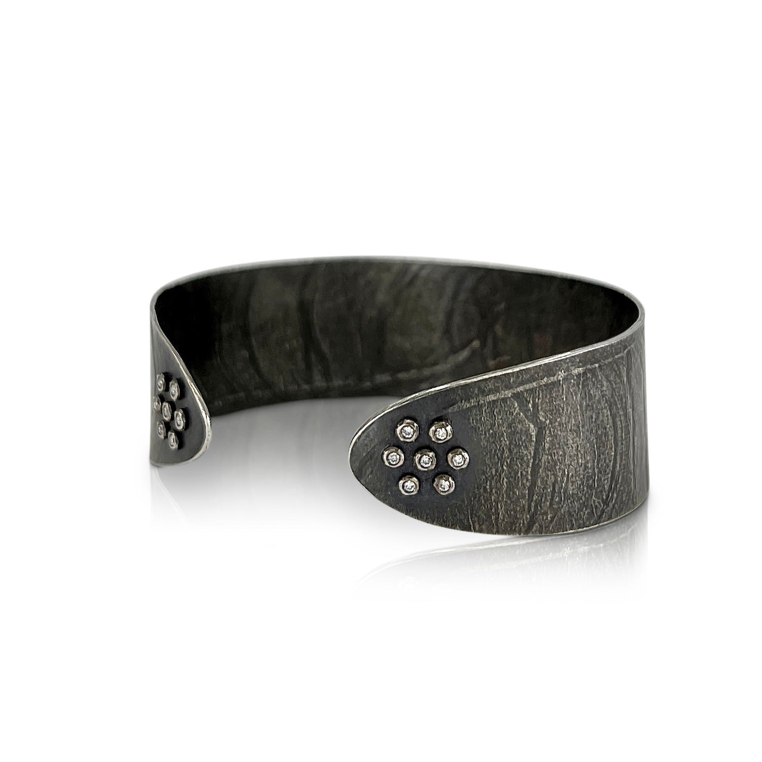 Narrow wafer cuff in oxidized sterling silver with 14 diamonds by Ayesha Mayadas