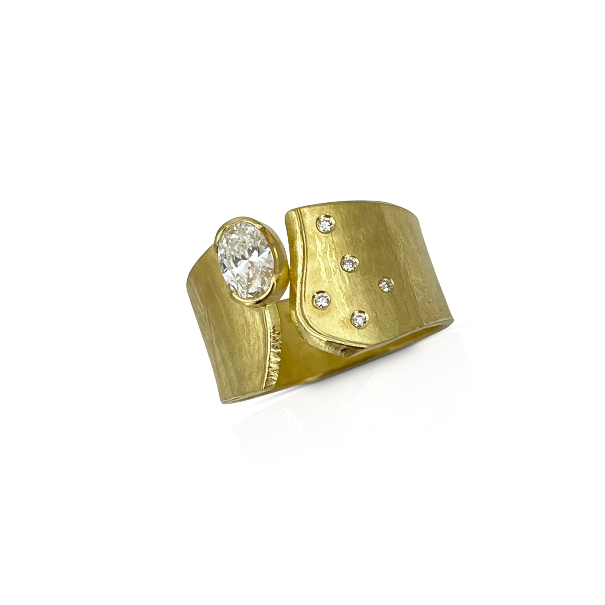 Wafer ring in 18K gold with oval lab created diamond and offset side diamonds
