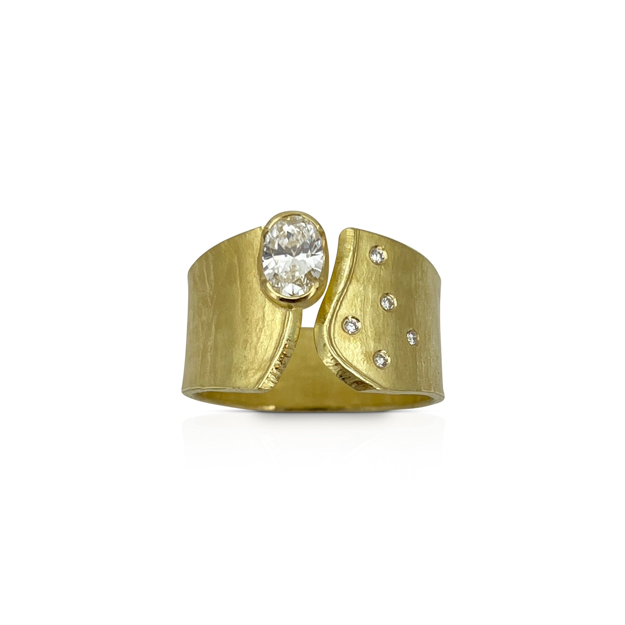 Wafer ring in 18K gold with oval lab created diamond and offset side diamonds