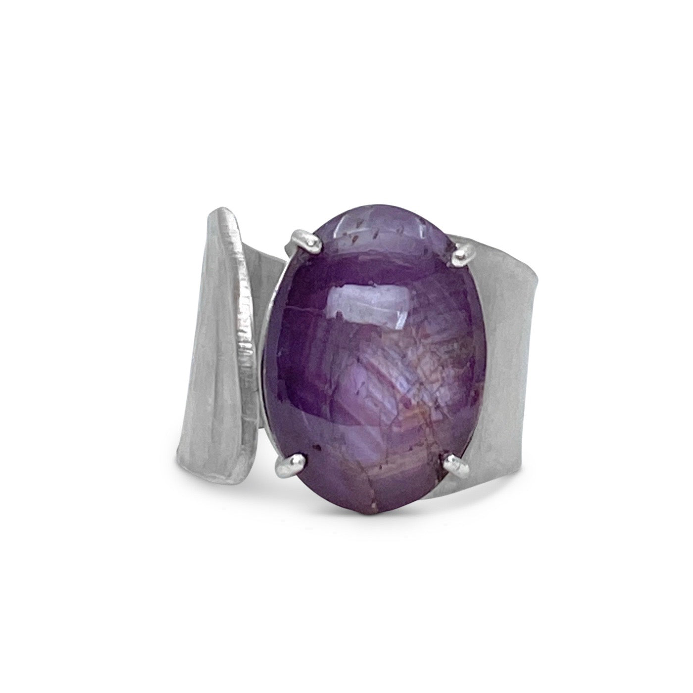 Wide Wafer texture ring in sterling silver with a large oval Star Ruby cabochon by Ayesha Mayadas shown on model