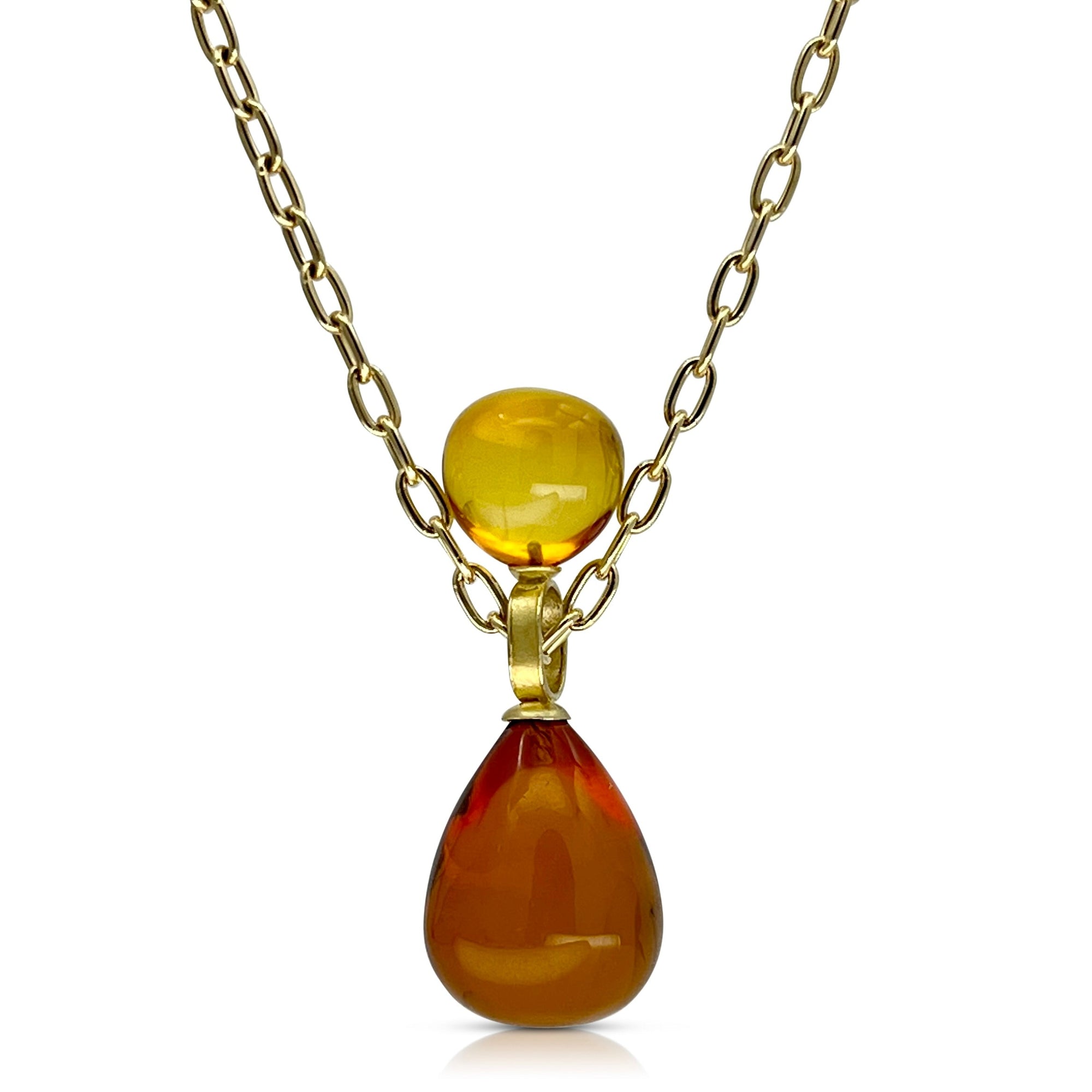 Stacked Baltic Amber pendant with 18K yellow gold 14k yellow gold chain shown on model made by Ayesha Mayadas