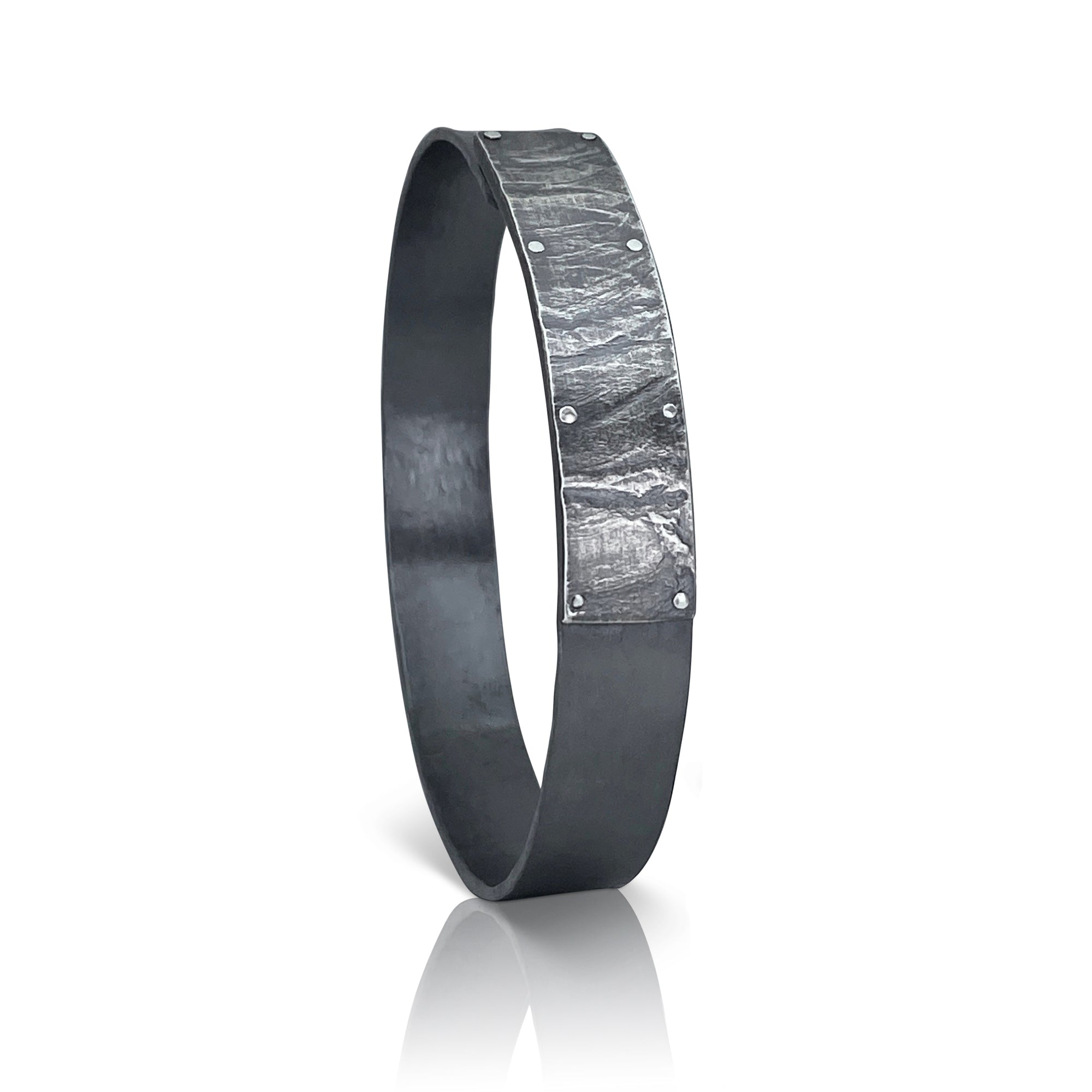 Men's rugged forged cuff in sterling silver with wafer textured band