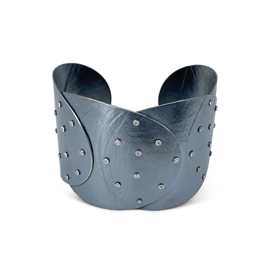 Wide sterling silver cuff with overlapping disks with diamonds by Ayesha Mayadas